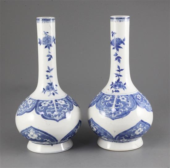 A pair of Chinese blue and white bottle vases, late 19th century, 28cm, one neck broken and glued